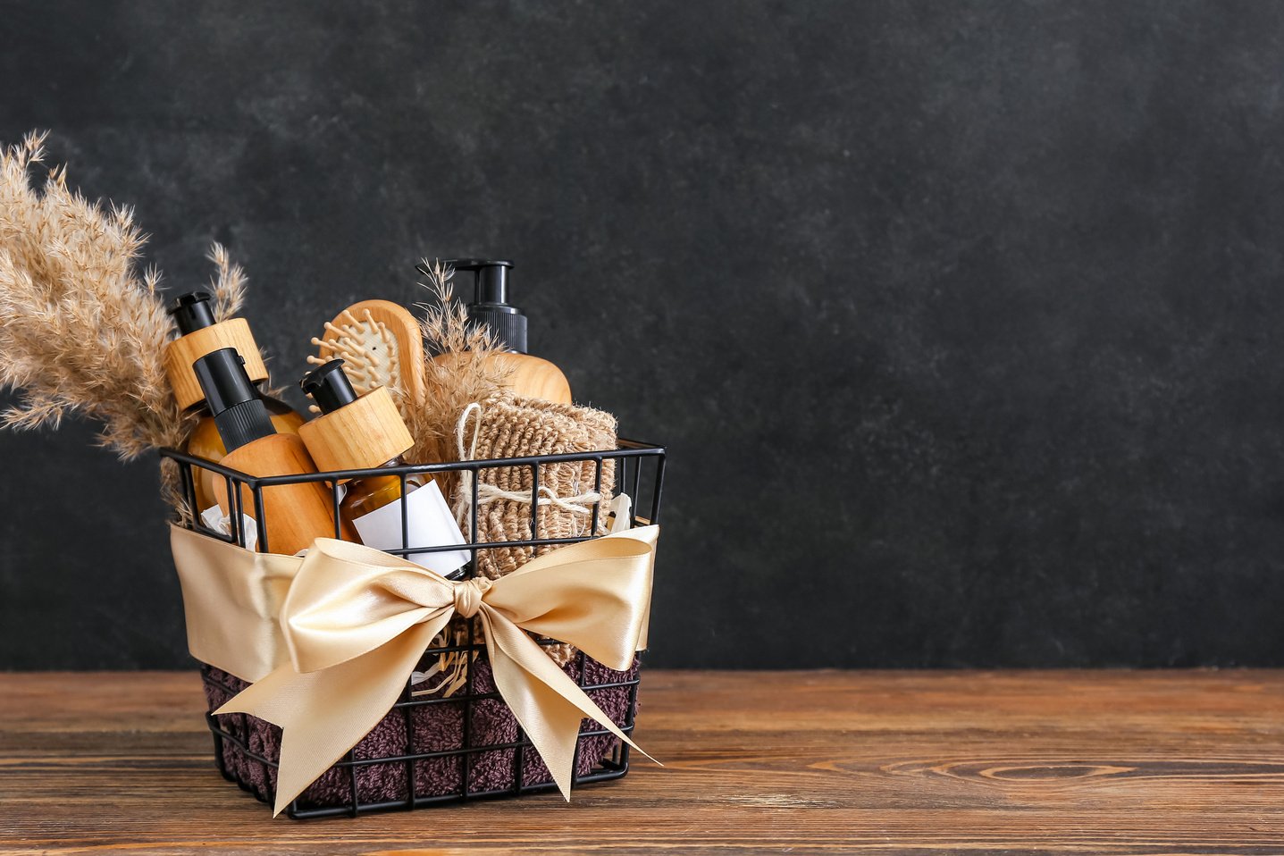 a basket filled with beauty products on a wooden table